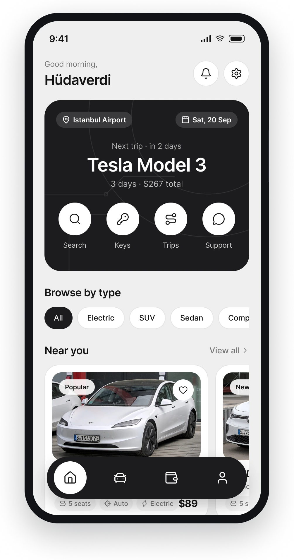 The Carro home screen with the next trip in a dark card and quick actions underneath