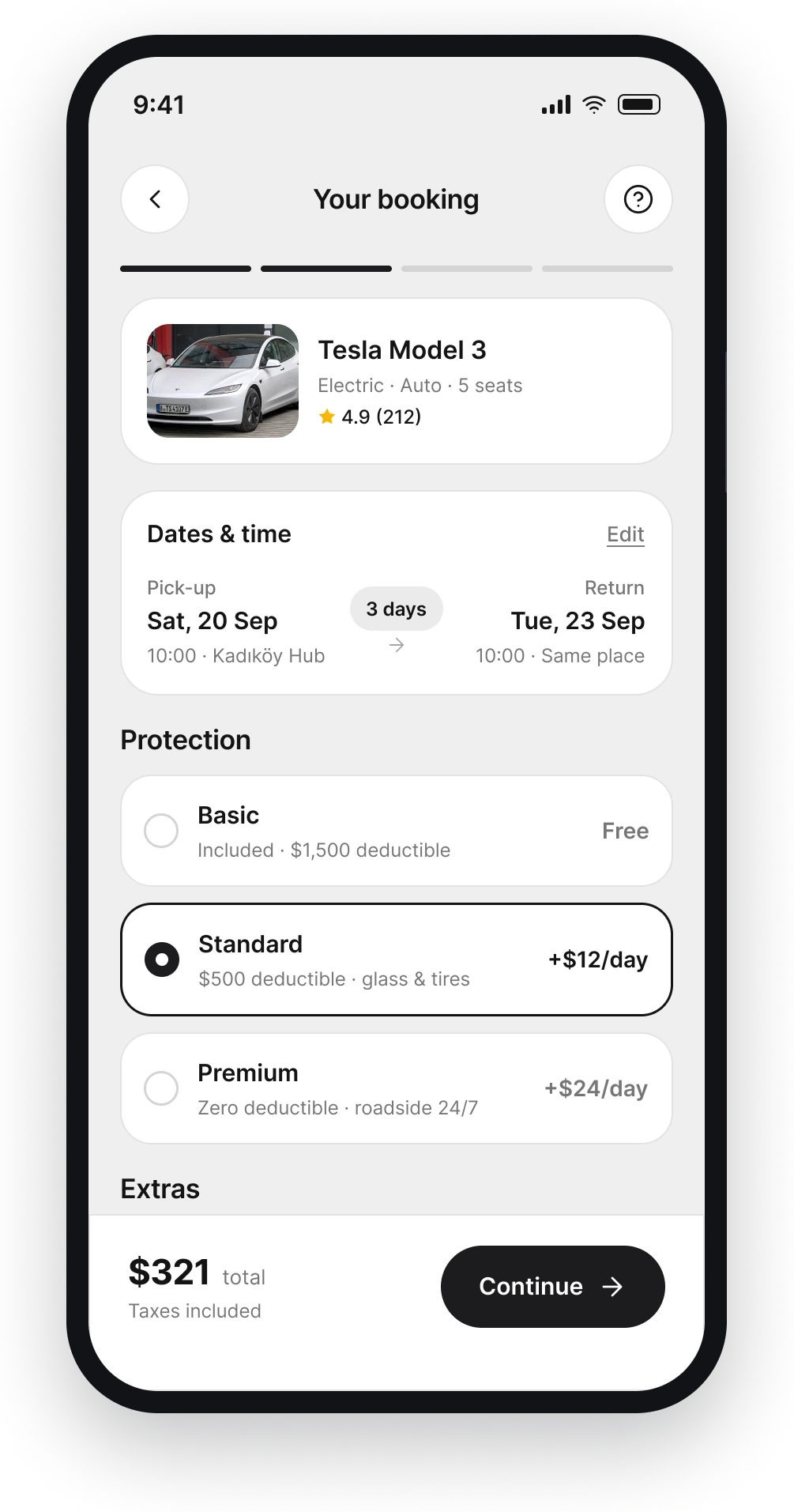 The Carro booking screen with protection plans and extras priced per day